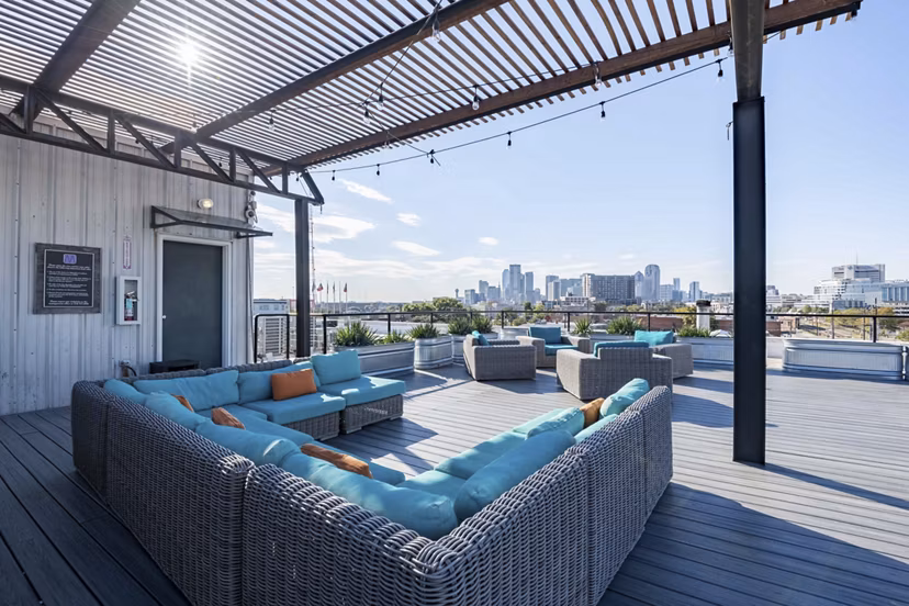 Scenic rooftop deck at Mitchell Lofts with city views, ideal for relaxation and social gatherings