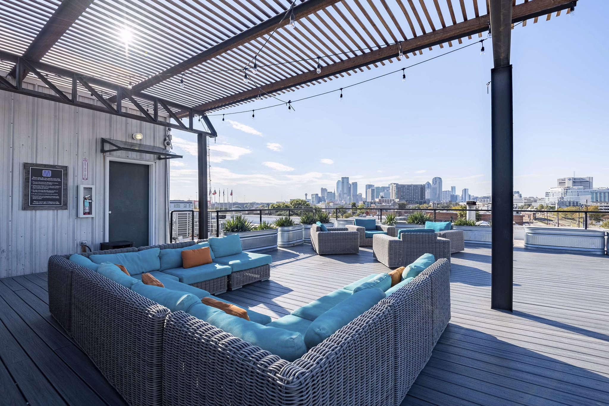 Scenic rooftop deck at Mitchell Lofts with city views, ideal for relaxation and social gatherings