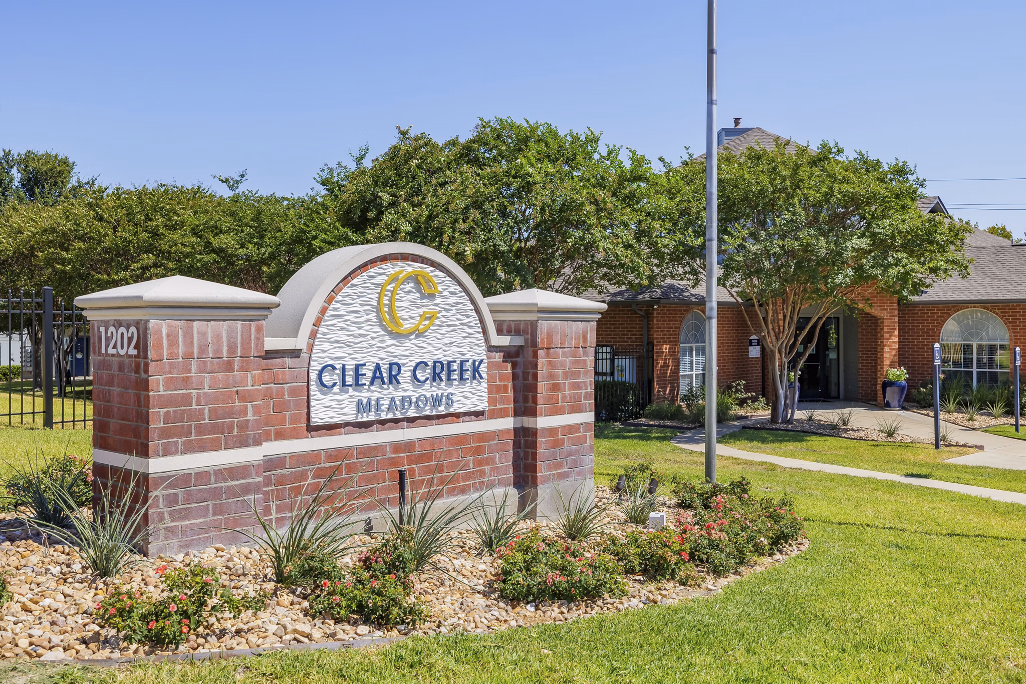 Signage at Clear Creek Meadows Apartments with elegant branding, welcoming residents to luxury living in a prime location
