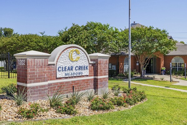 Signage at Clear Creek Meadows Apartments with elegant branding, welcoming residents to luxury living in a prime location