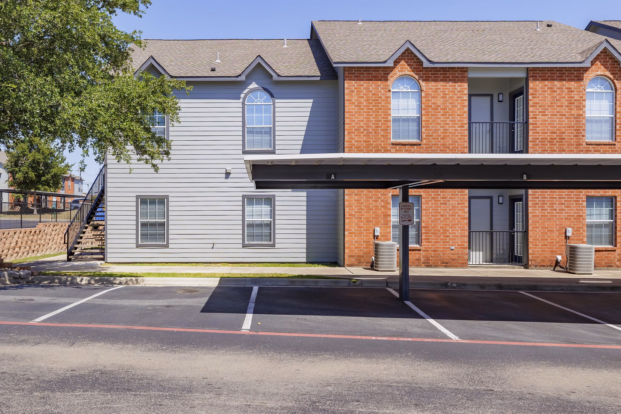 Clear Creek Meadows: Elegant of luxury apartments surrounded by lush landscaping in a serene suburban setting