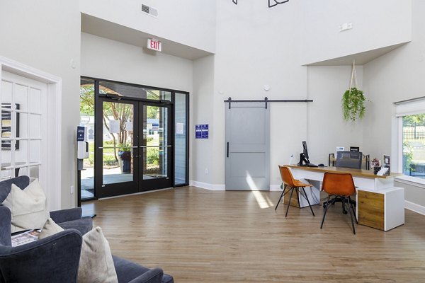 Clubhouse featuring modern design and cozy seating at Clear Creek Meadows Apartments