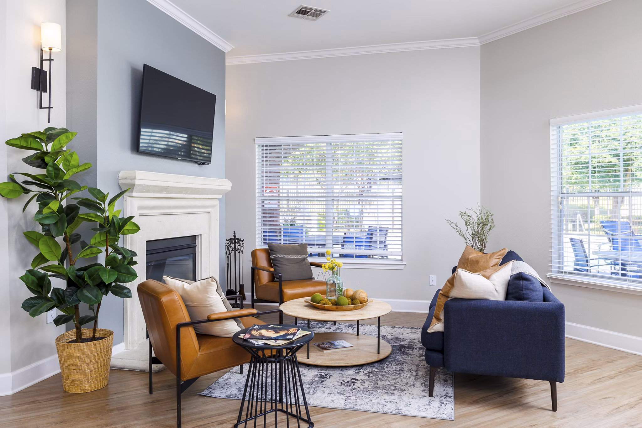 Clubhouse featuring modern furnishings and spacious seating area at Clear Creek Meadows Apartments
