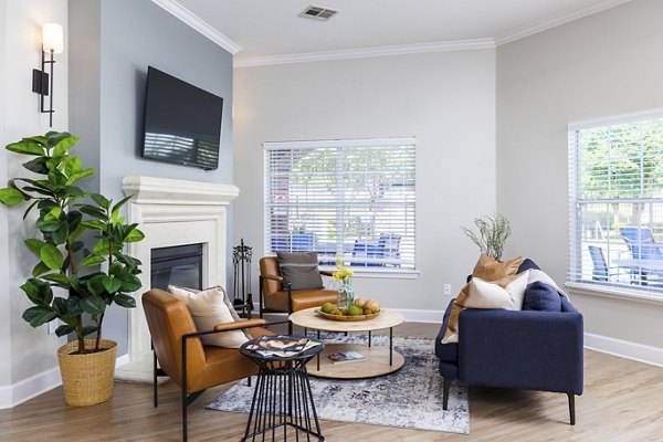 Clubhouse featuring modern furnishings and spacious seating area at Clear Creek Meadows Apartments