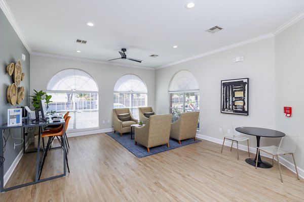 Clear Creek Meadows Apartments: Modern clubhouse featuring comfortable seating and entertainment options