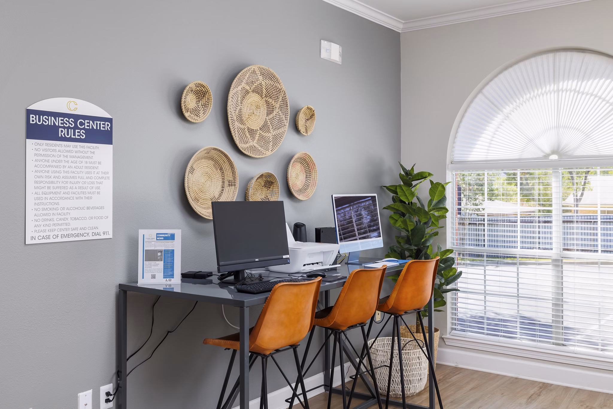 Business center with modern workstations at Clear Creek Meadows Apartments, a luxury property offering convenient amenities and stylish living spaces