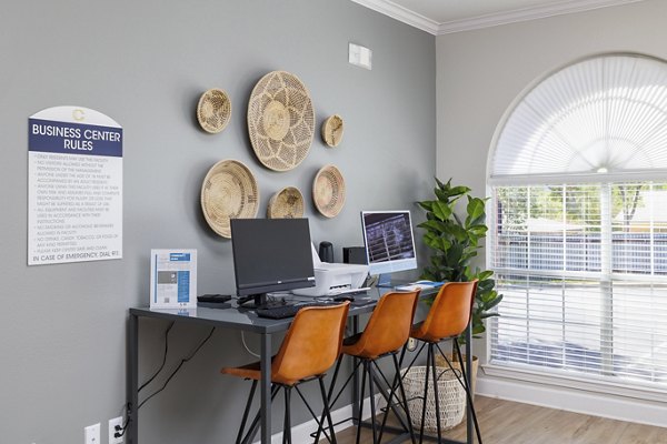 Business center with modern workstations at Clear Creek Meadows Apartments, a luxury property offering convenient amenities and stylish living spaces