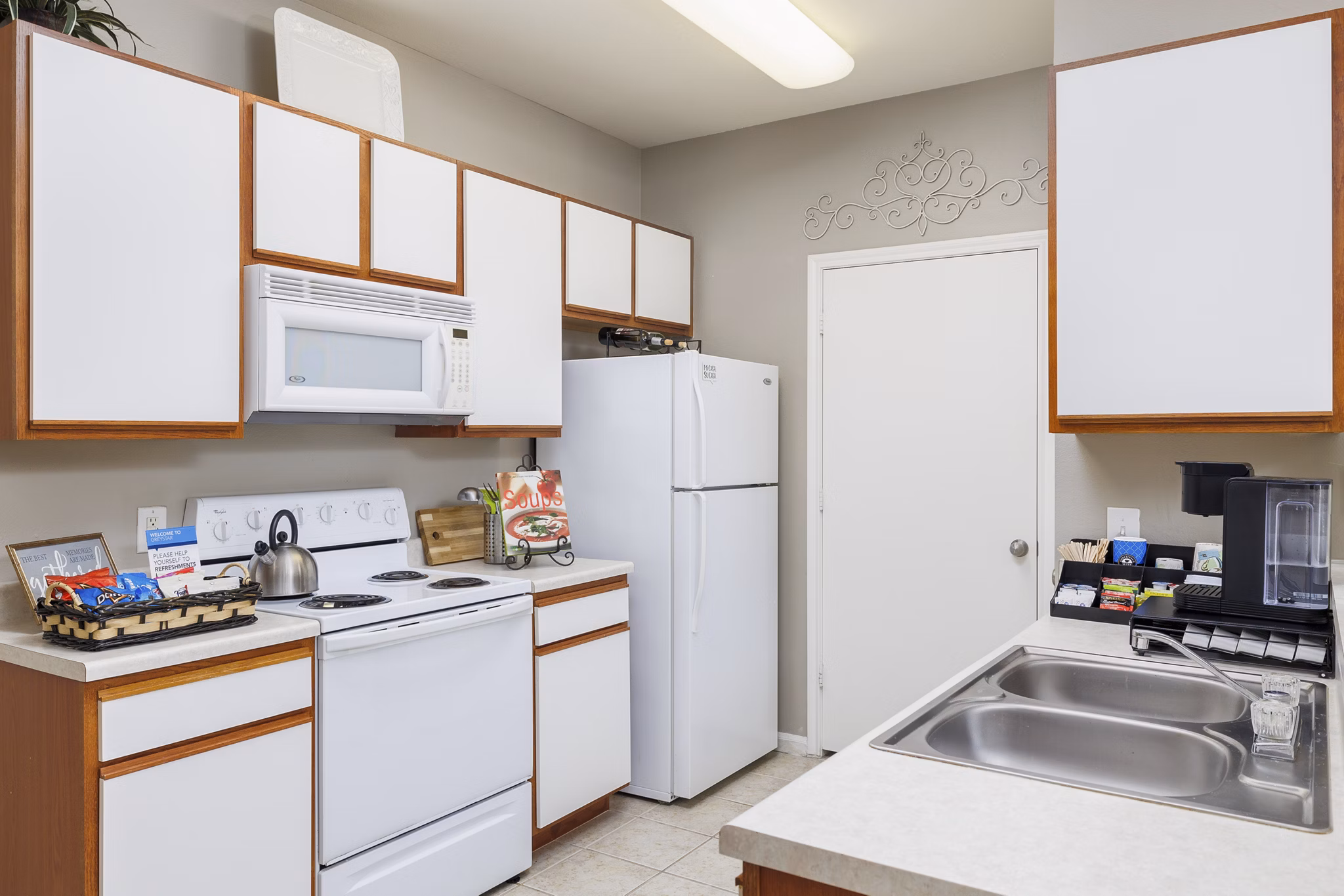 Modern kitchen with sleek countertops and stainless steel appliances at Clear Creek Meadows Apartments