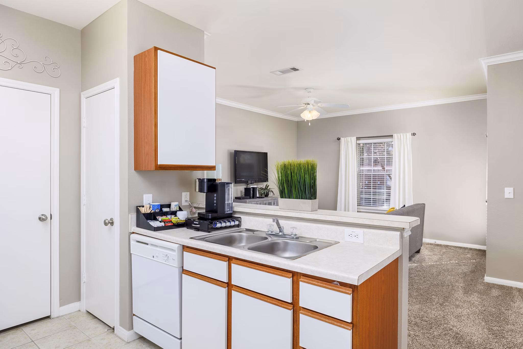 Modern kitchen with granite countertops and stainless steel appliances at Clear Creek Meadows Apartments
