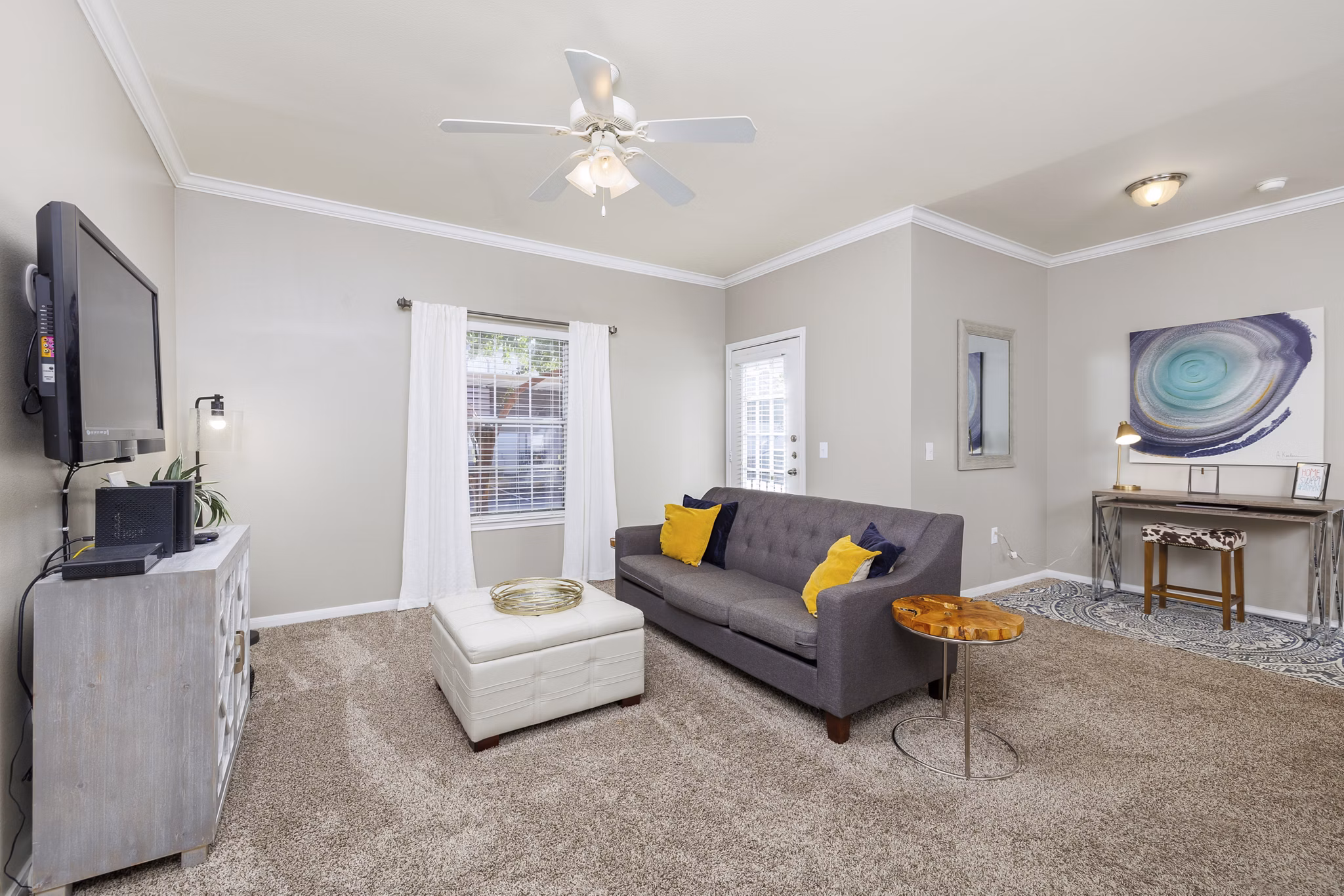 Warm-toned living room with modern furniture in Clear Creek Meadows Apartments, perfect for relaxation and entertainment