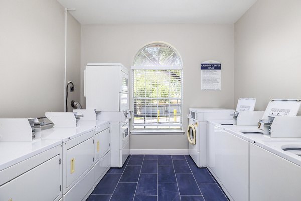 Modern laundry facility with efficient machines at Clear Creek Meadows Apartments