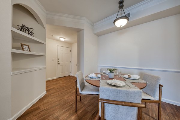 Dining area featuring modern decor and spacious seating at South Bay Apartments, luxury living by the bay