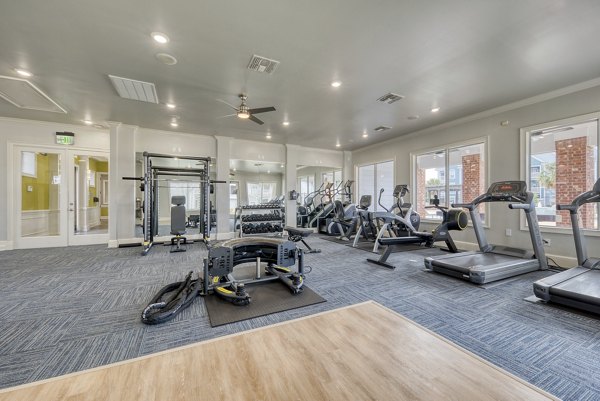 State-of-the-art fitness center with modern equipment at South Bay Apartments, offering residents a luxurious workout experience