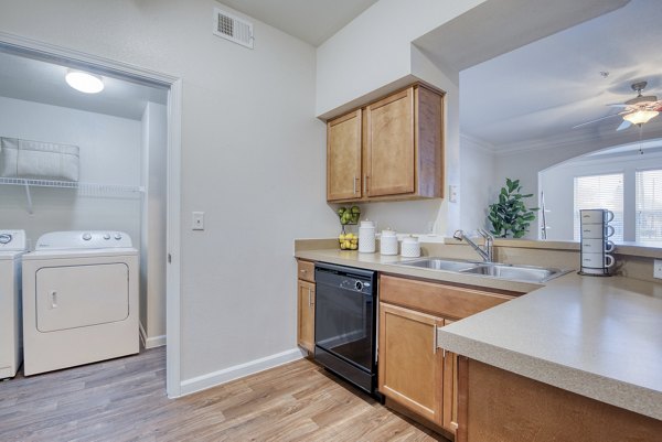 Modern kitchen with stainless steel appliances at South Bay Apartments