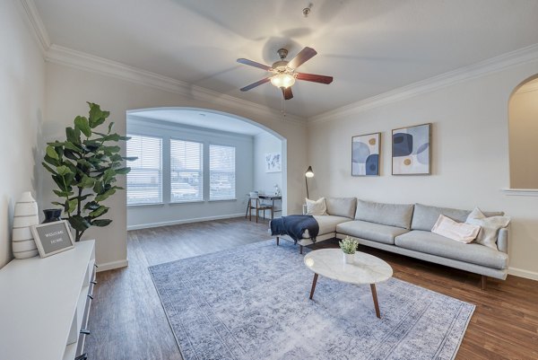 Spacious living room with modern decor at South Bay Apartments, featuring luxury interior design for comfortable urban living