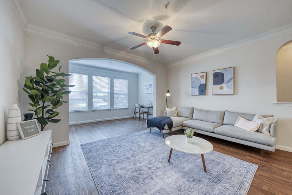 Spacious living room with modern decor at South Bay Apartments, featuring luxury interior design for comfortable urban living