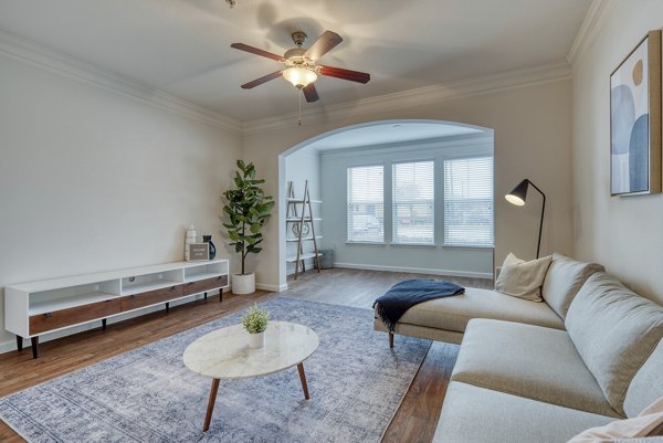 Spacious living room with modern decor at South Bay Apartments