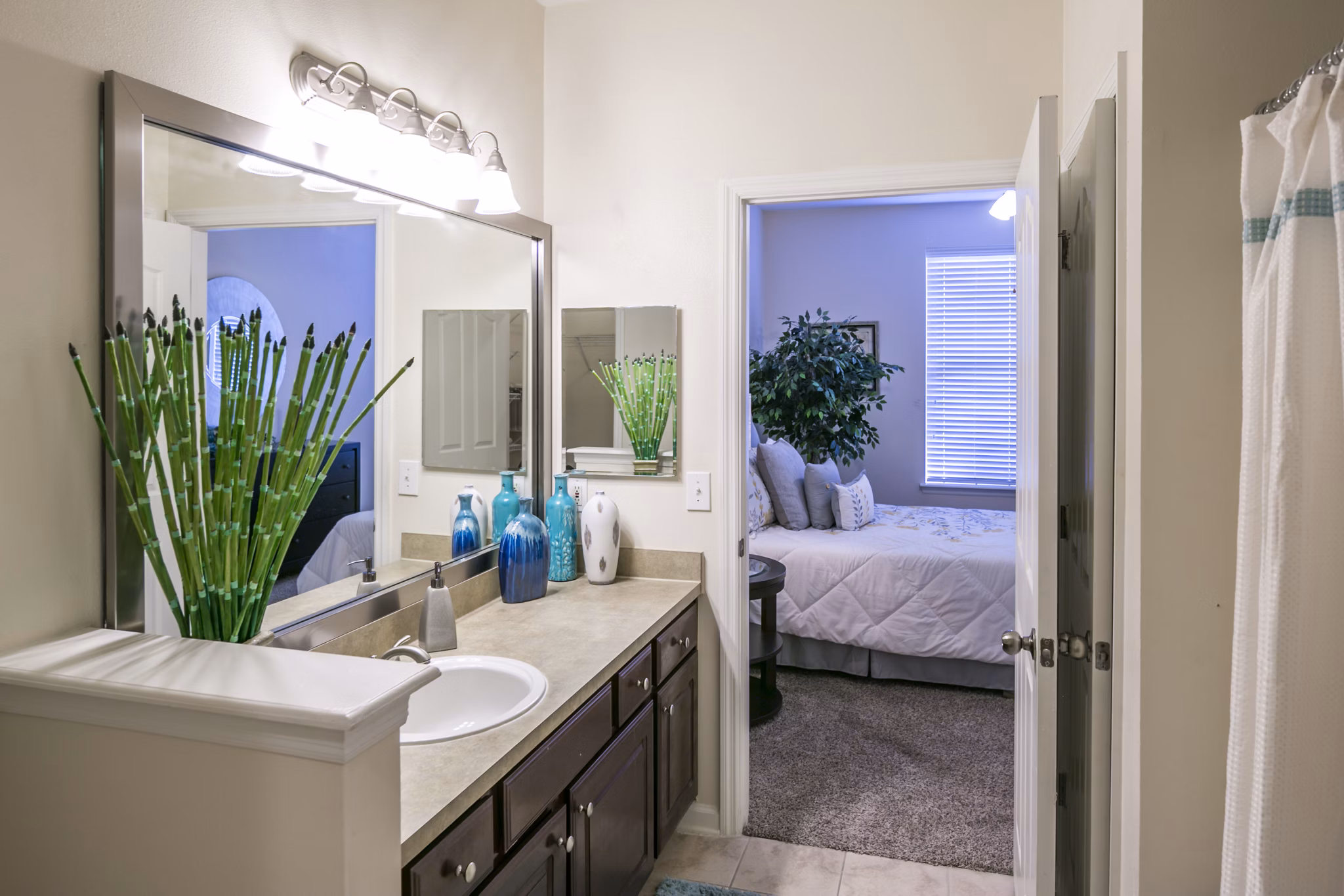 Luxury bathroom with sleek slate tiles and modern fixtures at Avana Sugar Land Apartments