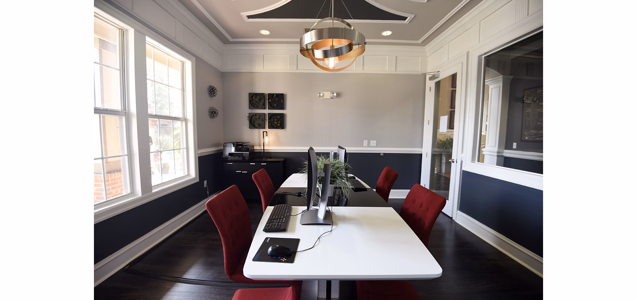 Modern business center featuring collaborative workspaces at Avana Sugar Land Apartments