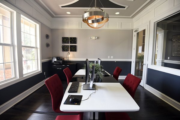 Modern business center featuring collaborative workspaces at Avana Sugar Land Apartments