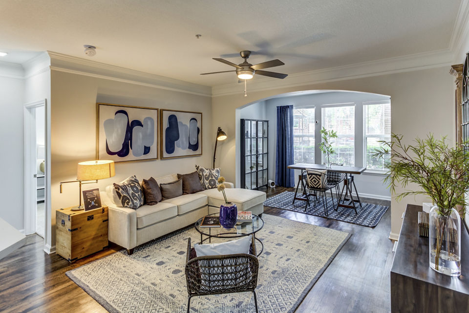 Living room showcasing modern sofas and natural light at Avana Sugar Land Apartments