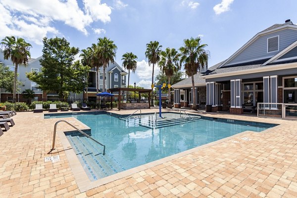Stylish pool area with sun loungers at Avana Sugar Land Apartments, offering luxury living in a vibrant community