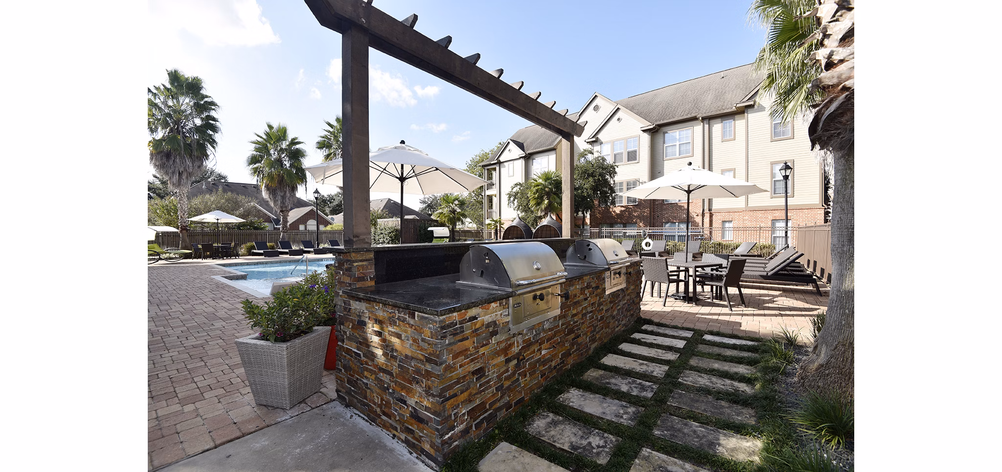 Outdoor grill area with modern appliances at Avana Sugar Land Apartments, perfect for social gatherings and barbecues