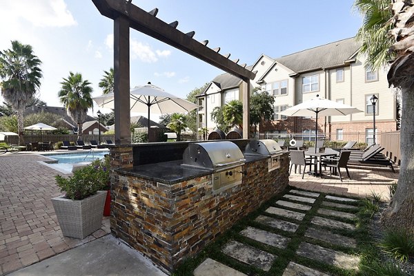 Outdoor grill area with modern appliances at Avana Sugar Land Apartments, perfect for social gatherings and barbecues