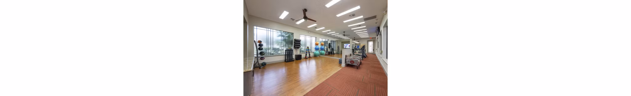 Modern yoga studio with natural lighting at West End Apartments, offering tranquil space for fitness and relaxation in Greystar's luxury community