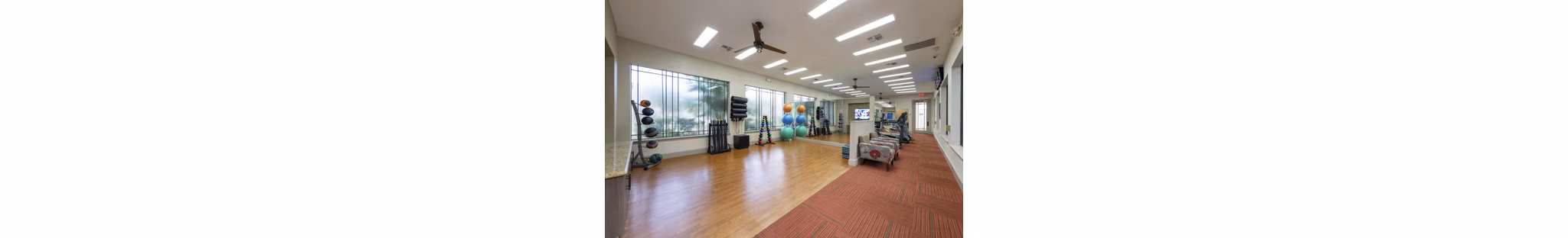 Modern yoga studio with natural lighting at West End Apartments, offering tranquil space for fitness and relaxation in Greystar's luxury community