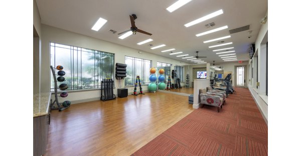 Modern yoga studio with natural lighting at West End Apartments, offering tranquil space for fitness and relaxation in Greystar's luxury community