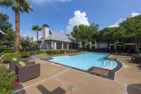 Relaxing poolside experience at West End Apartments, featuring luxury amenities and modern design in a vibrant community
