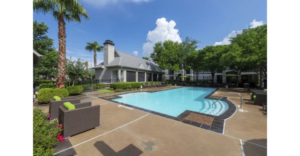 Relaxing poolside experience at West End Apartments, featuring luxury amenities and modern design in a vibrant community