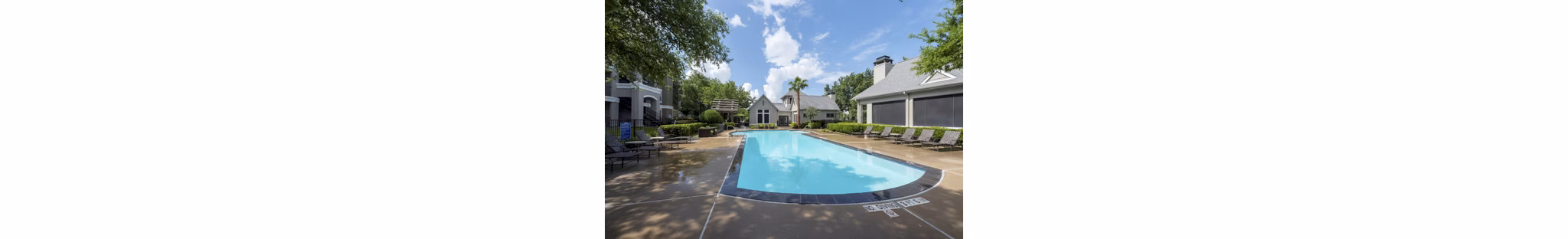 Relaxing pool with lounge area at West End Apartments, luxurious community offering modern amenities and recreational spaces