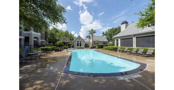 Relaxing pool with lounge area at West End Apartments, luxurious community offering modern amenities and recreational spaces