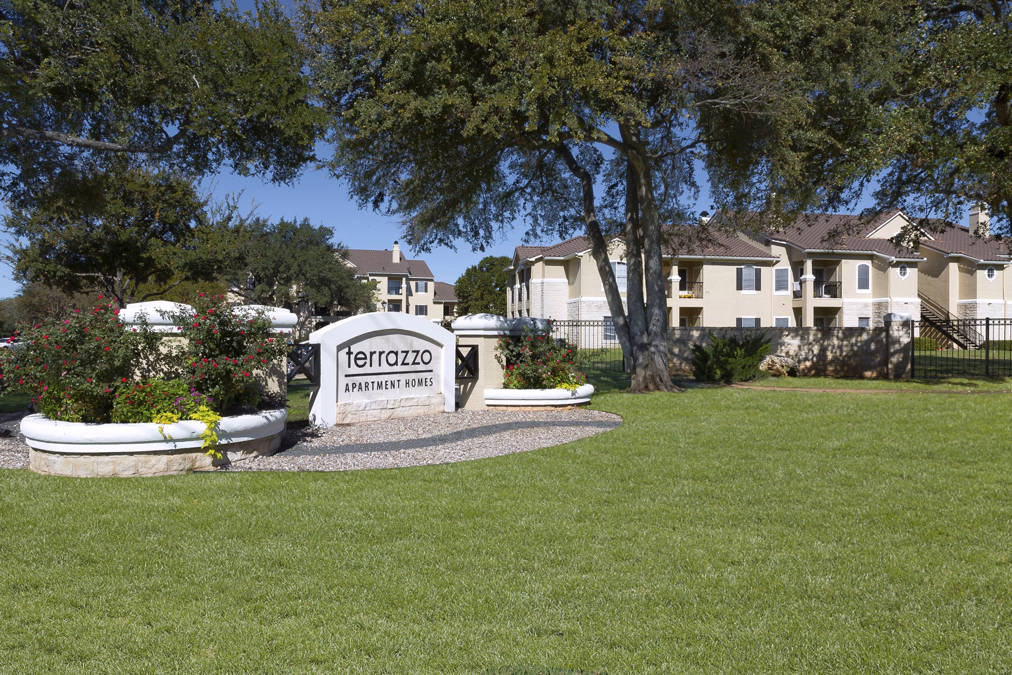 Terrazzo Apartments: Modern signage and of luxury apartments in vibrant neighborhood