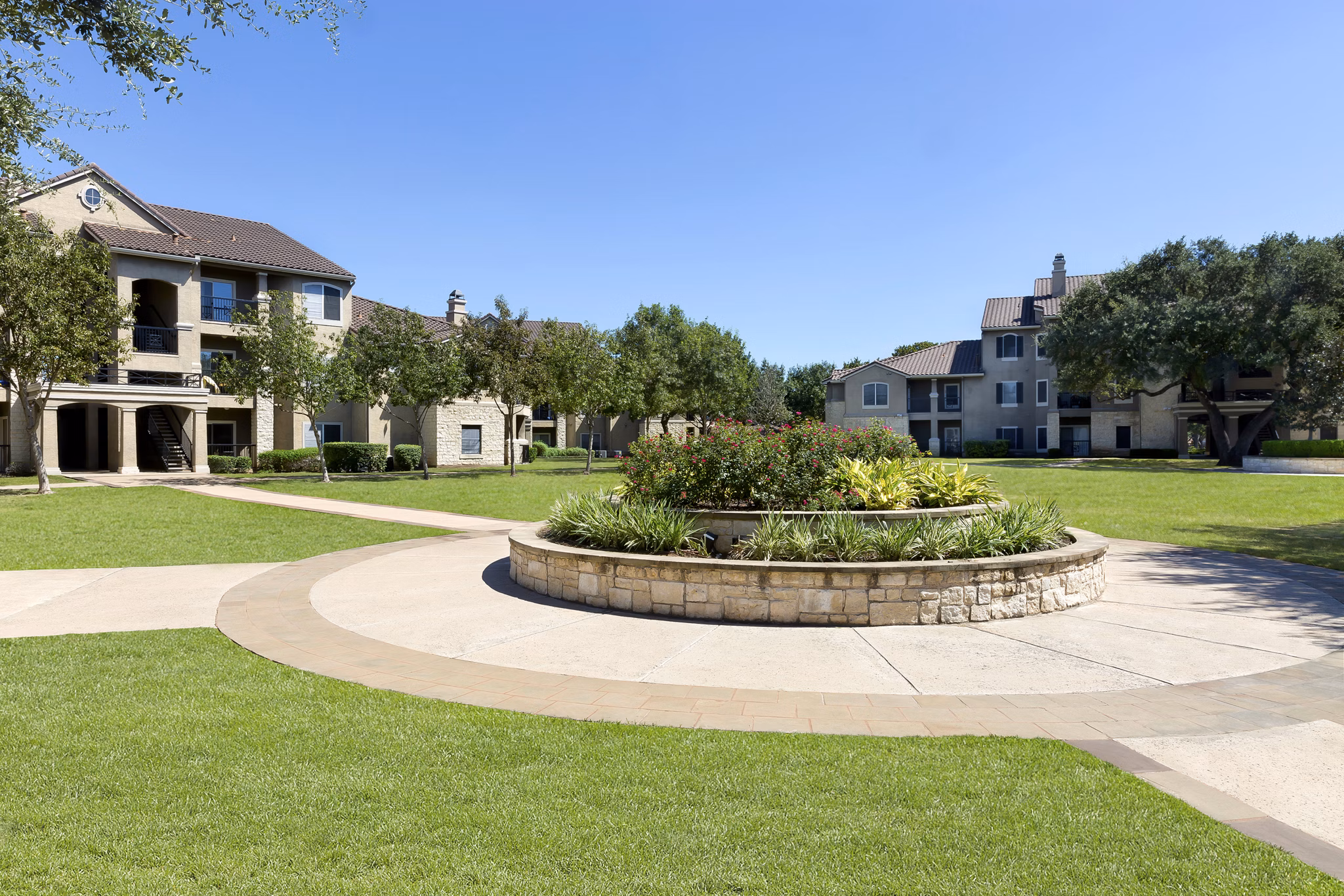 Courtyard at Terrazzo Apartments: Tranquil outdoor space with lush landscaping and seating areas