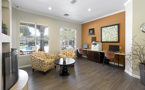 Modern business center with sleek workstations at Terrazzo Apartments