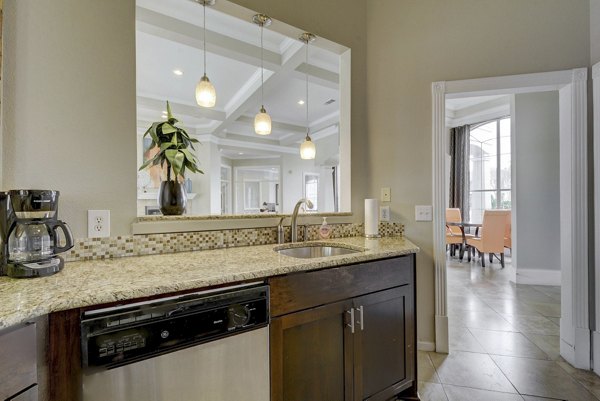 Spacious kitchen with modern appliances at Terrazzo Apartments for luxury living