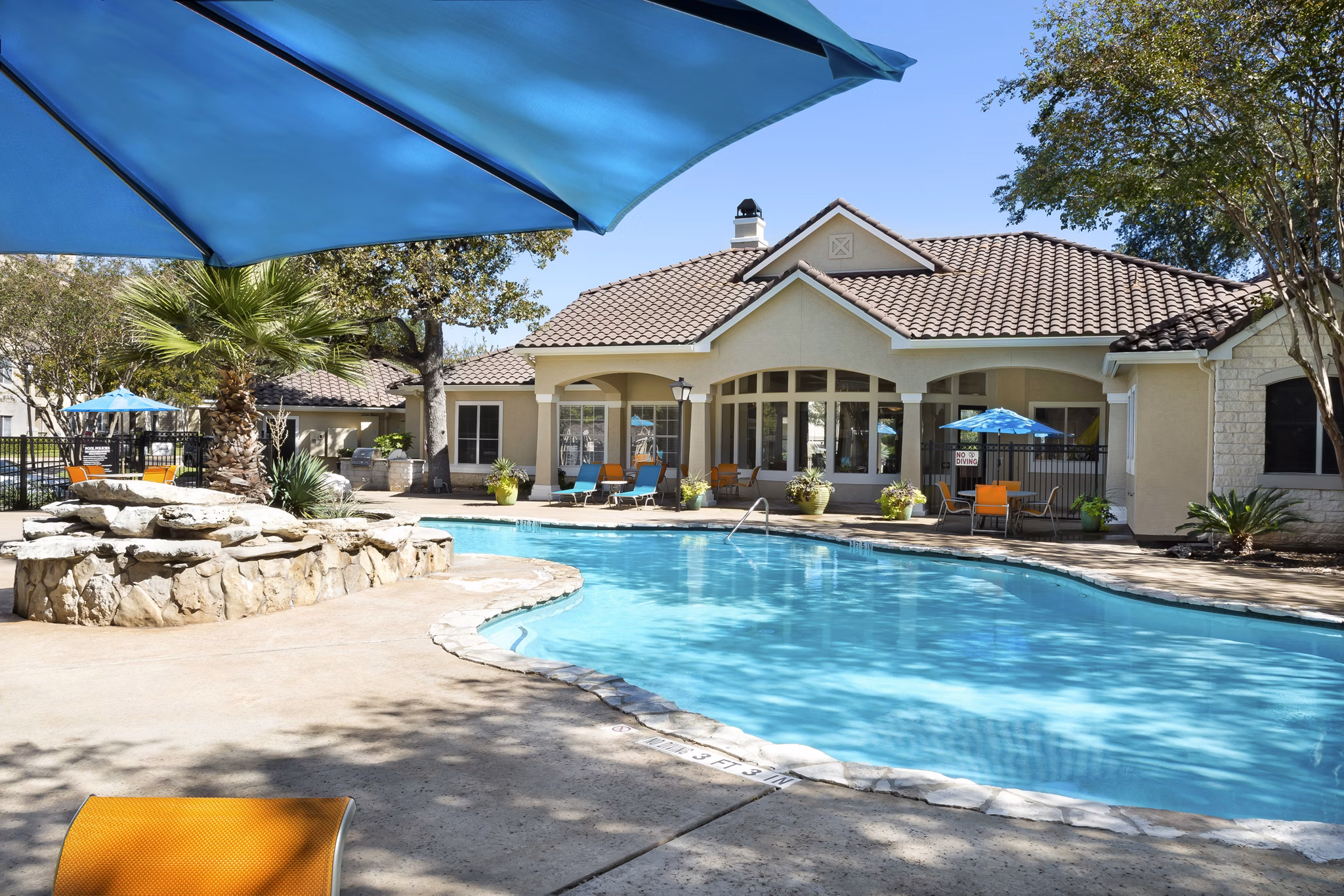 Resort-style pool with lounge chairs at Terrazzo Apartments in Miami, offering a luxury outdoor oasis for relaxation and recreation