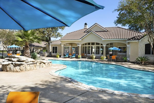 Resort-style pool with lounge chairs at Terrazzo Apartments in Miami, offering a luxury outdoor oasis for relaxation and recreation