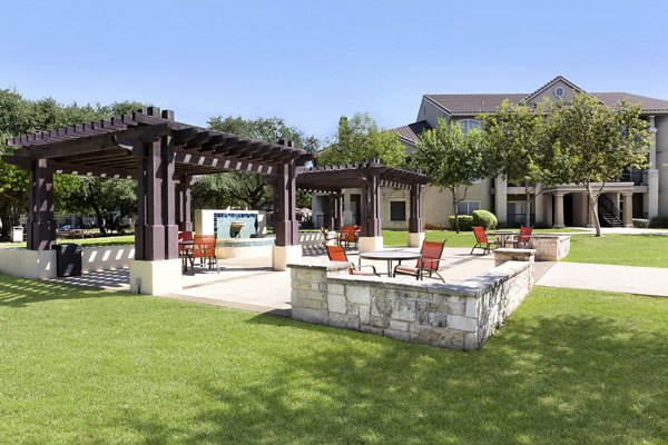 Chic outdoor patio with modern seating at Terrazzo Apartments, perfect for relaxation and social gatherings