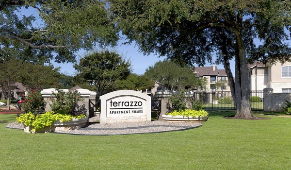 Terrazzo Apartments sign in front of a luxury high-rise building
