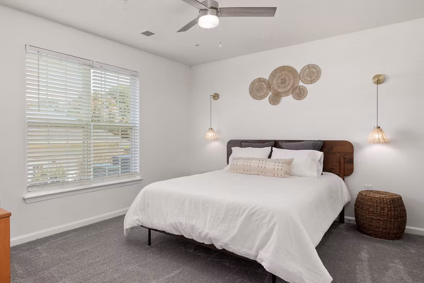 Luxe bedroom with contemporary furnishings at Patriots Pointe Apartments