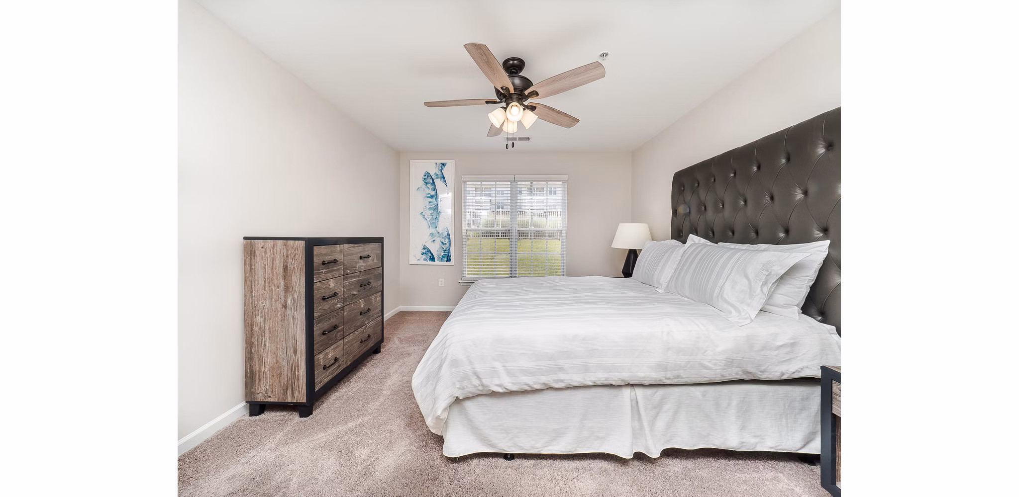 Luxe bedroom with contemporary furnishings at Patriots Pointe Apartments
