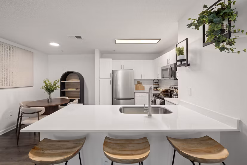 Modern kitchen with stainless steel appliances at Patriots Pointe Apartments