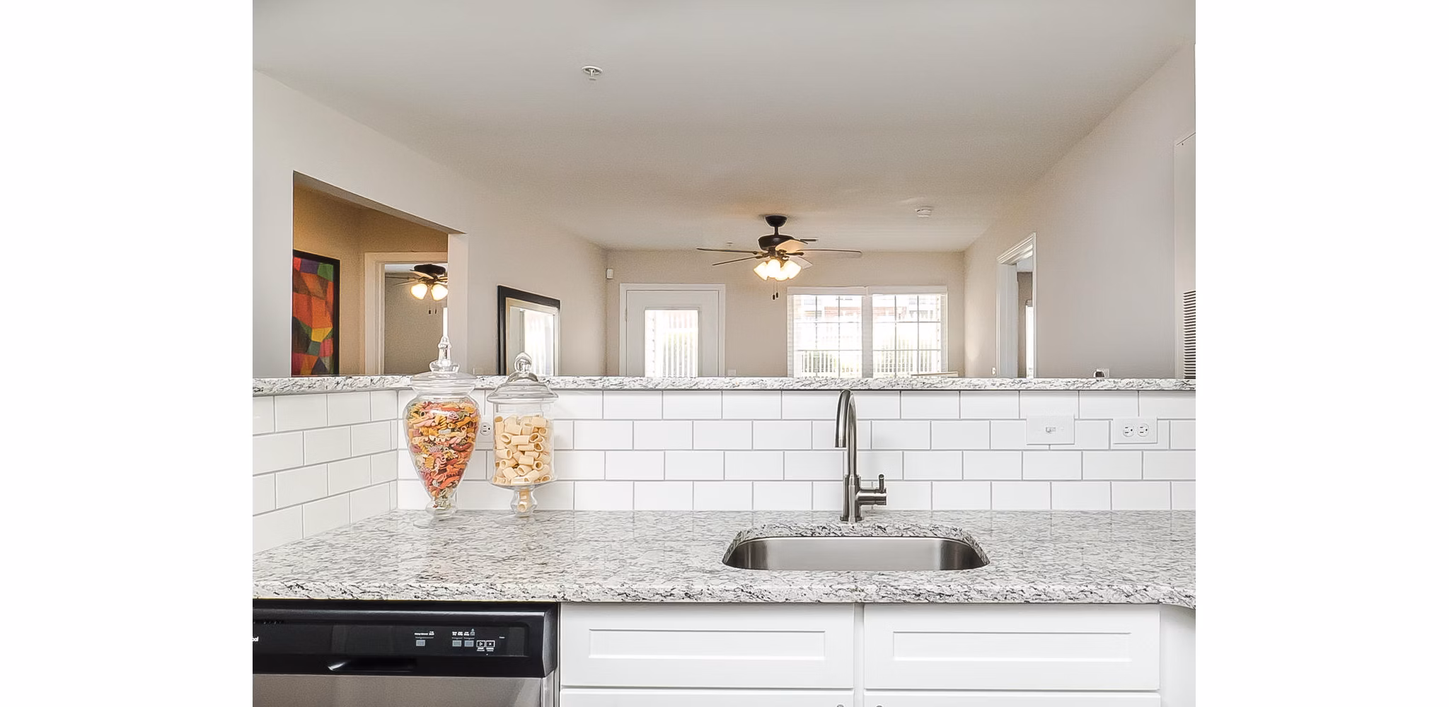 Modern kitchen with stainless steel appliances at Patriots Pointe Apartments