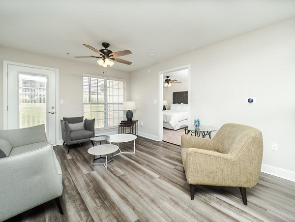 Cozy living room with modern decor at Patriots Pointe Apartments luxury by Greystar