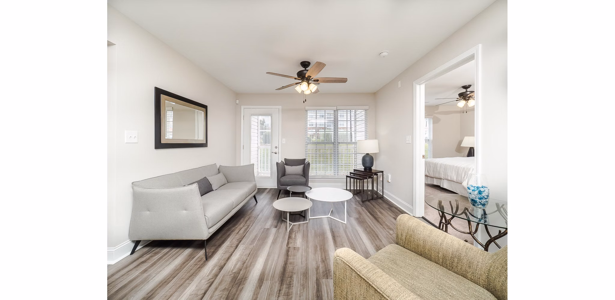 Cozy living room with stylish decor at Patriots Pointe Apartments, showcasing elegant furnishings and natural light ideal for relaxation and entertaining