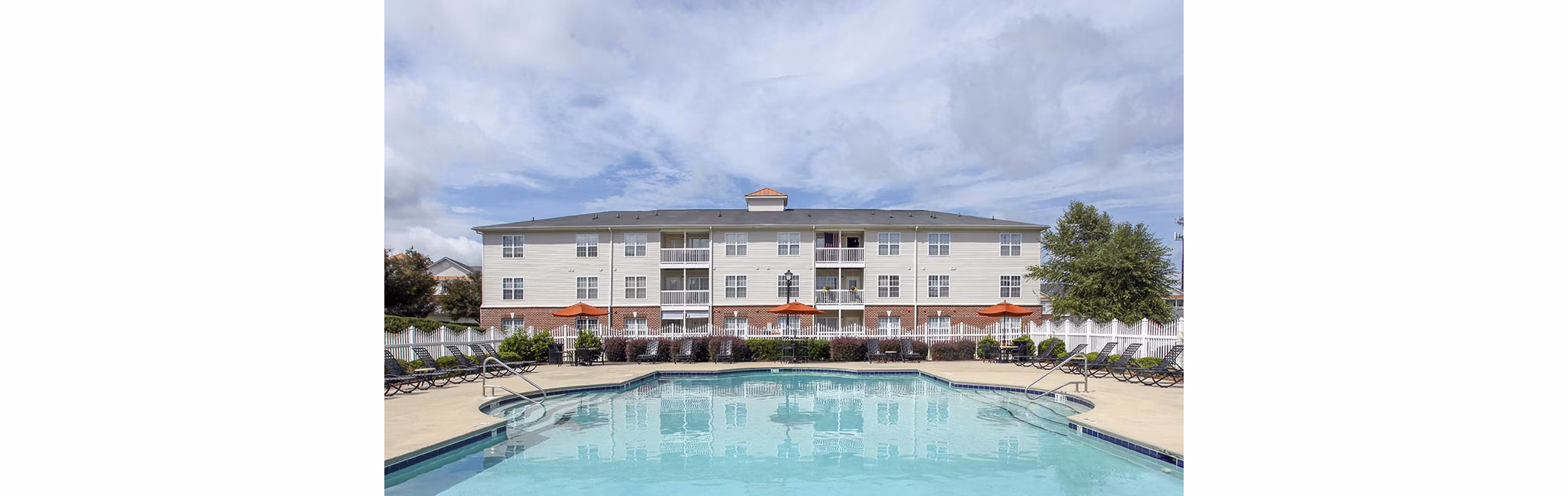 Inviting outdoor pool area at Patriots Pointe Apartments offering a relaxing escape for residents